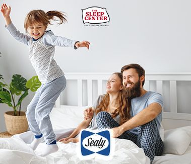 Dad and daughter playing on Sealy Mattress