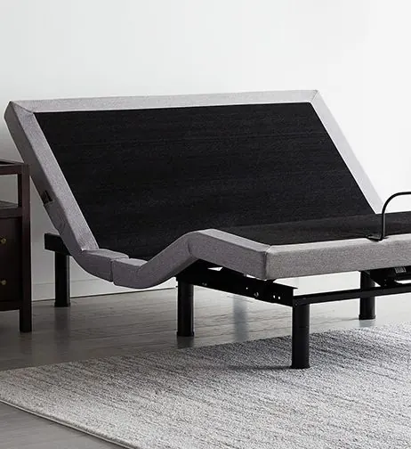 Adjustable bed base raised in a bedroom