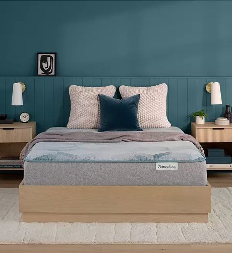 Simmons BeautySleep mattress on a light wood bed frame