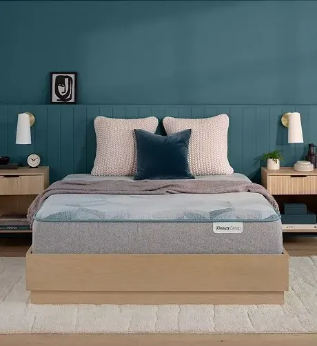 Simmons BeautySleep mattress on a light wood bed frame