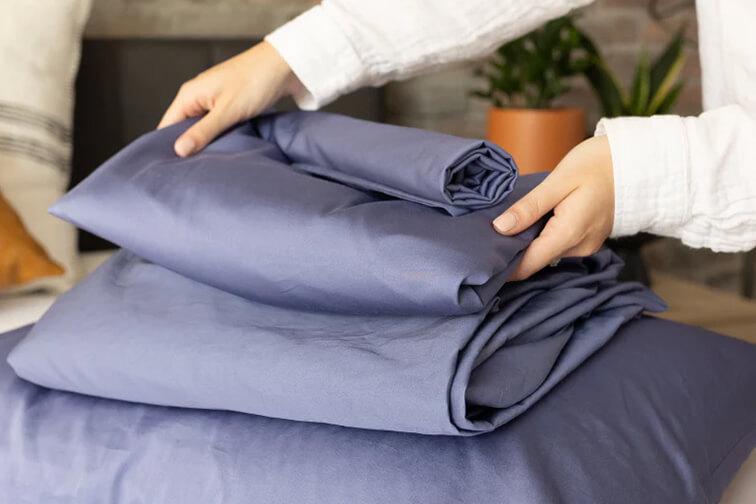Folding a fresh set of sheets