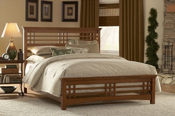 Wood headboard and footboard on a made bed